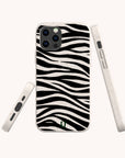The Zebra Eco-Friendly Phone Case features a black and white zebra stripe pattern, is made from compostable biodegradable materials, and has precise cutouts for the camera and buttons. Shown from the back and sides against a light background.