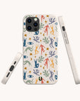 The Joie de Vivre Eco-Friendly Phone Case, decorated with a colorful abstract pattern of human figures, stars, leaves, and eyes on a speckled base, is displayed from the front, side, and back against a plain light background.