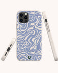 The Blue Marble Swirl Eco-Friendly Phone Case, featuring a blue and white wavy abstract marble pattern, is displayed from three angles—back, side, and bottom—against a plain light background.