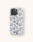 The Sea Shells Eco-Friendly Phone Case features a beige finish with blue line-art seashell and dot patterns on a light background. Made sustainably, it's compatible with iPhone and Samsung Galaxy models.