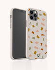 The Mini Confetti Eco-Friendly Phone Case features a terrazzo pattern with orange, yellow, pink, and green shapes. Compatible with iPhone and Samsung Galaxy models, it covers the back and sides of your phone.