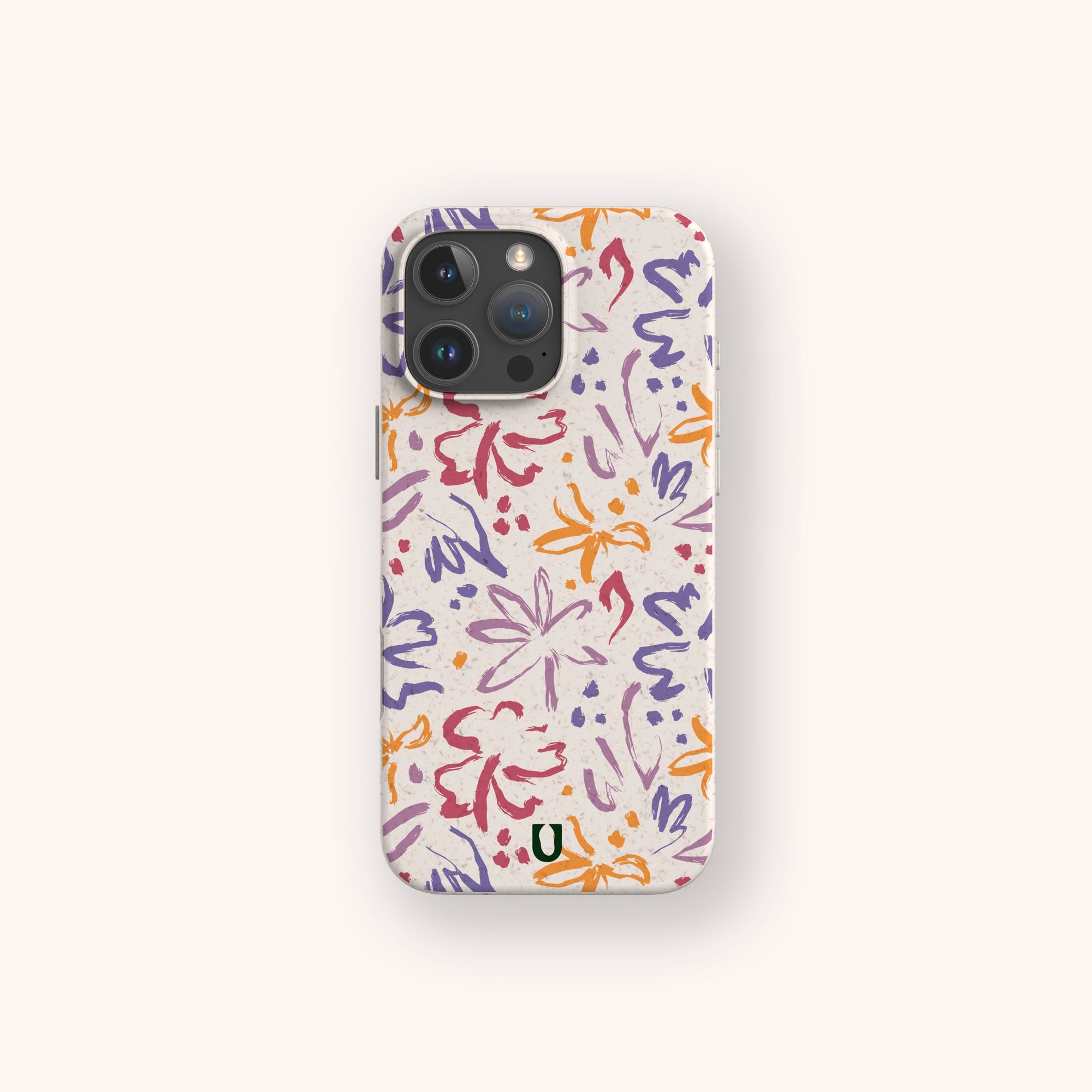 The Flower Strokes Eco-Friendly Phone Case features abstract purple, orange, red, and pink floral brushstrokes on a light background with a small "U" logo. Compatible with iPhone and Samsung Galaxy.
