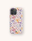 The Flower Strokes Eco-Friendly Phone Case features abstract purple, orange, red, and pink floral brushstrokes on a light background with a small "U" logo. Compatible with iPhone and Samsung Galaxy.