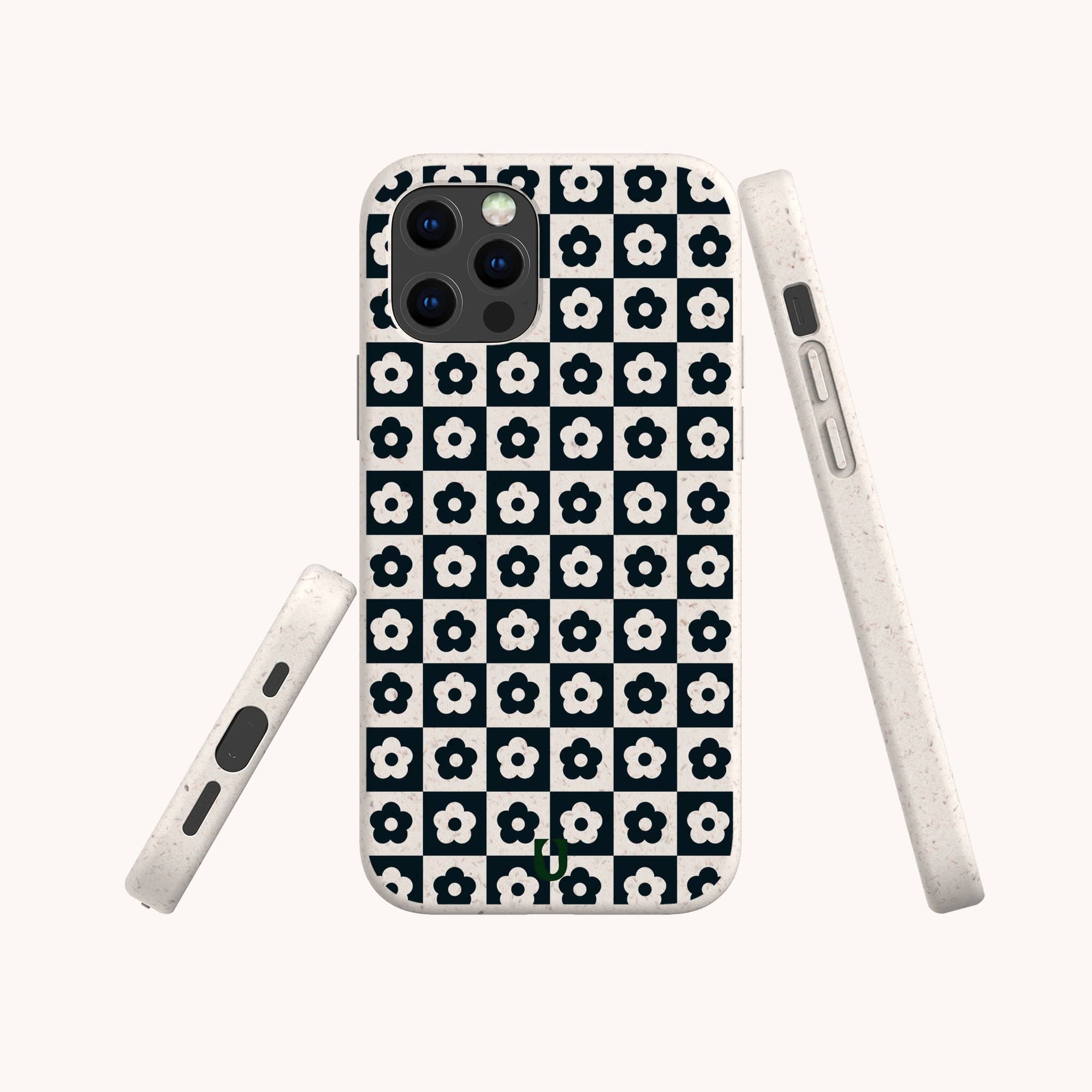 The Black Flower Checker Eco-Friendly Phone Case, made from biodegradable materials, displays white flowers on a black and white checkerboard pattern. The case is shown from the back and both sides on a plain light background.