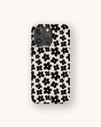 The Black Flower Power Eco-Friendly Phone Case features black, stylized retro floral patterns in various sizes on a white background.
