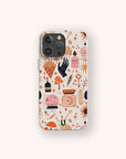 The Love Spell Eco-Friendly Phone Case is a biodegradable smartphone case adorned with whimsical illustrations of magical objects like potions, mushrooms, candles, stars, crystals, and hands on a light background.