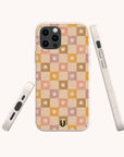 The Star Pink Checker Eco-Friendly Phone Case features a retro pink, orange, and beige checkered pattern with small flowers. The case is displayed from the back and sides against a plain light background.