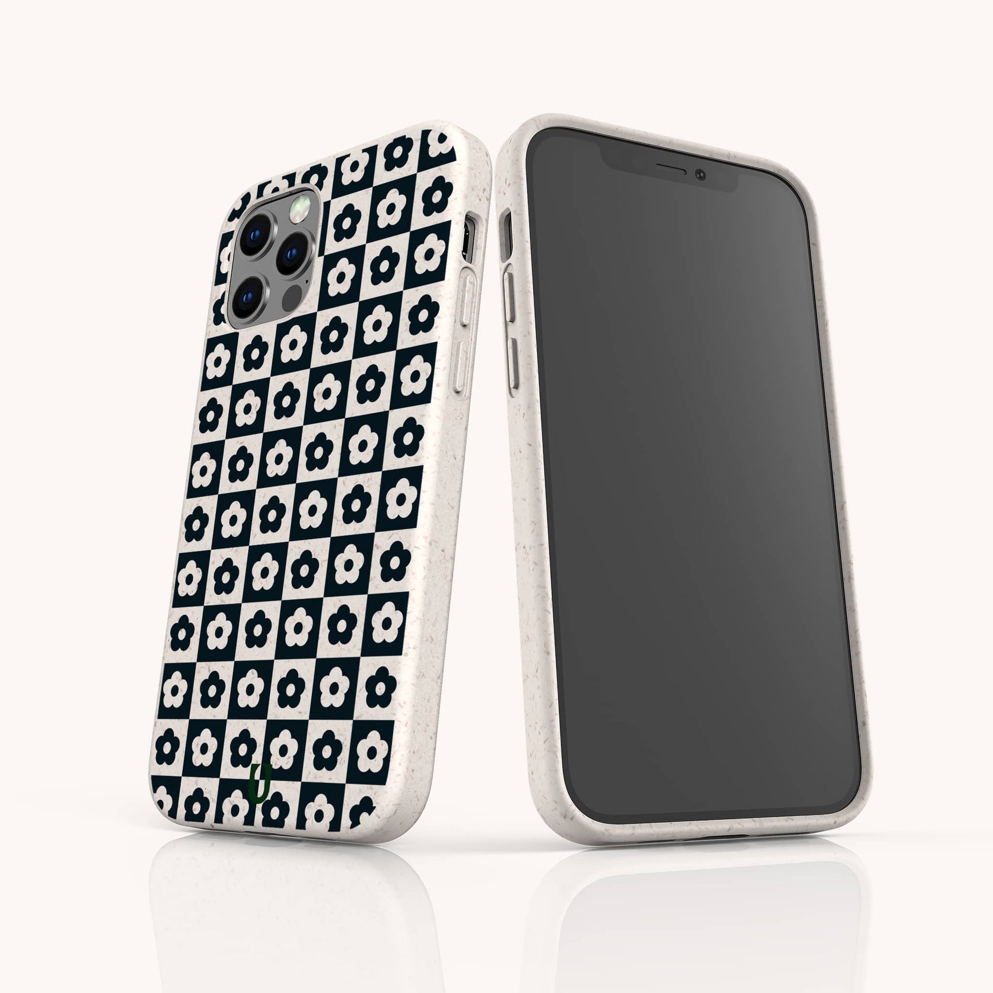 Two smartphones in white cases: one features the Black Flower Checker Eco-Friendly Phone Case, showcasing its black and white floral checker design, while the other displays a blank, dark screen facing forward.