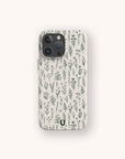The Green Wild Flowers Eco-Friendly Phone Case, compatible with iPhone and Samsung Galaxy, showcases a delicate pattern of green botanical illustrations with flowers and leaves on a light background.