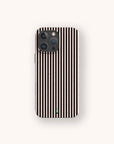 A smartphone featuring the Thin Black Stripes Eco-Friendly Phone Case, which has a minimalist black and white vertical stripe design, is displayed on a plain light background. The phone includes three camera lenses and a small green indicator near the bottom.