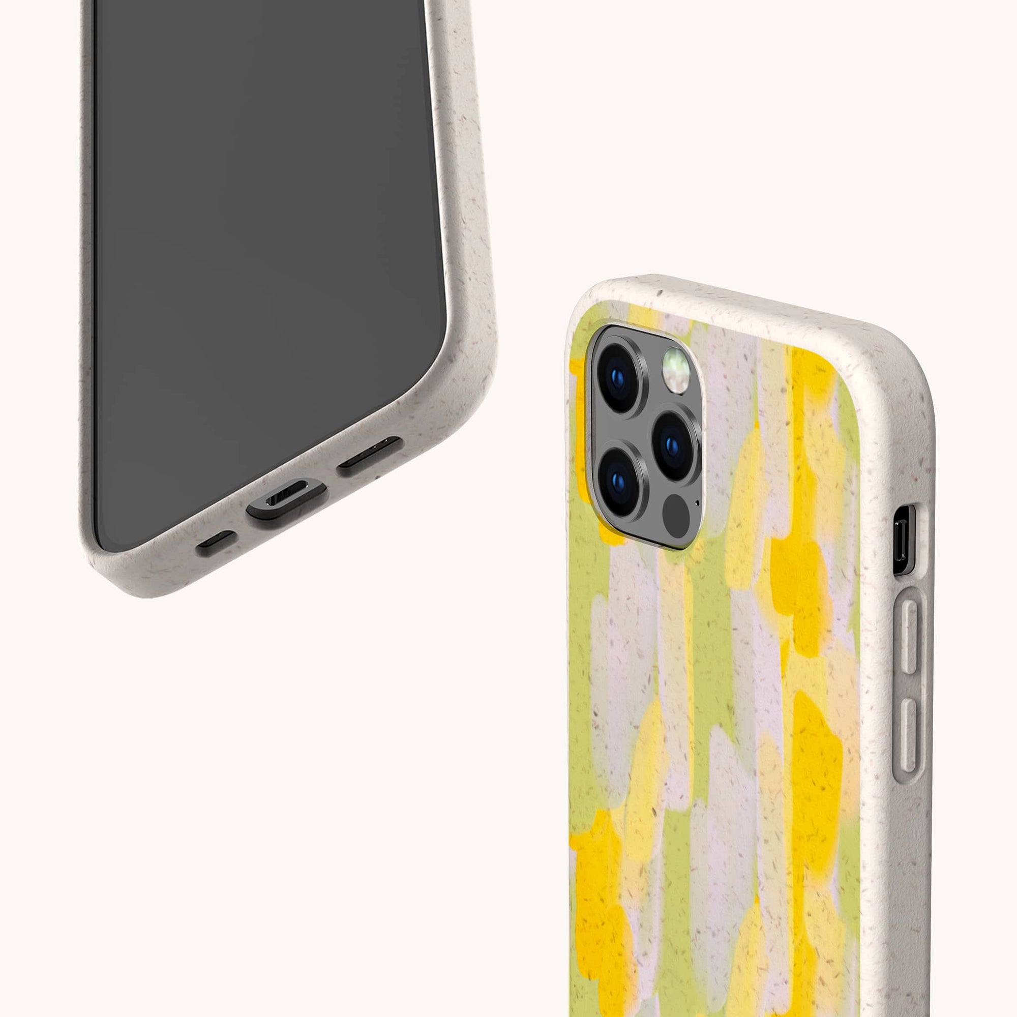Two smartphones in vegan-friendly, speckled beige cases. The Lime Sorbet Eco-Friendly Phone Case shows a yellow, green, and purple abstract pattern; the other shows the phone's front with a plain, speckled beige edge.