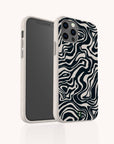 The Black Marble Swirl Eco-Friendly Phone Case features a compostable white case with a black and white abstract wavy design, resembling zebra stripes, offering stylish and sustainable protection for your smartphone.
