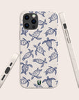 The Turtles Eco-Friendly Phone Case is made from sustainable materials and features blue sea turtle designs on a white speckled background, shown from the back and sides to highlight its design and precise button cutouts.