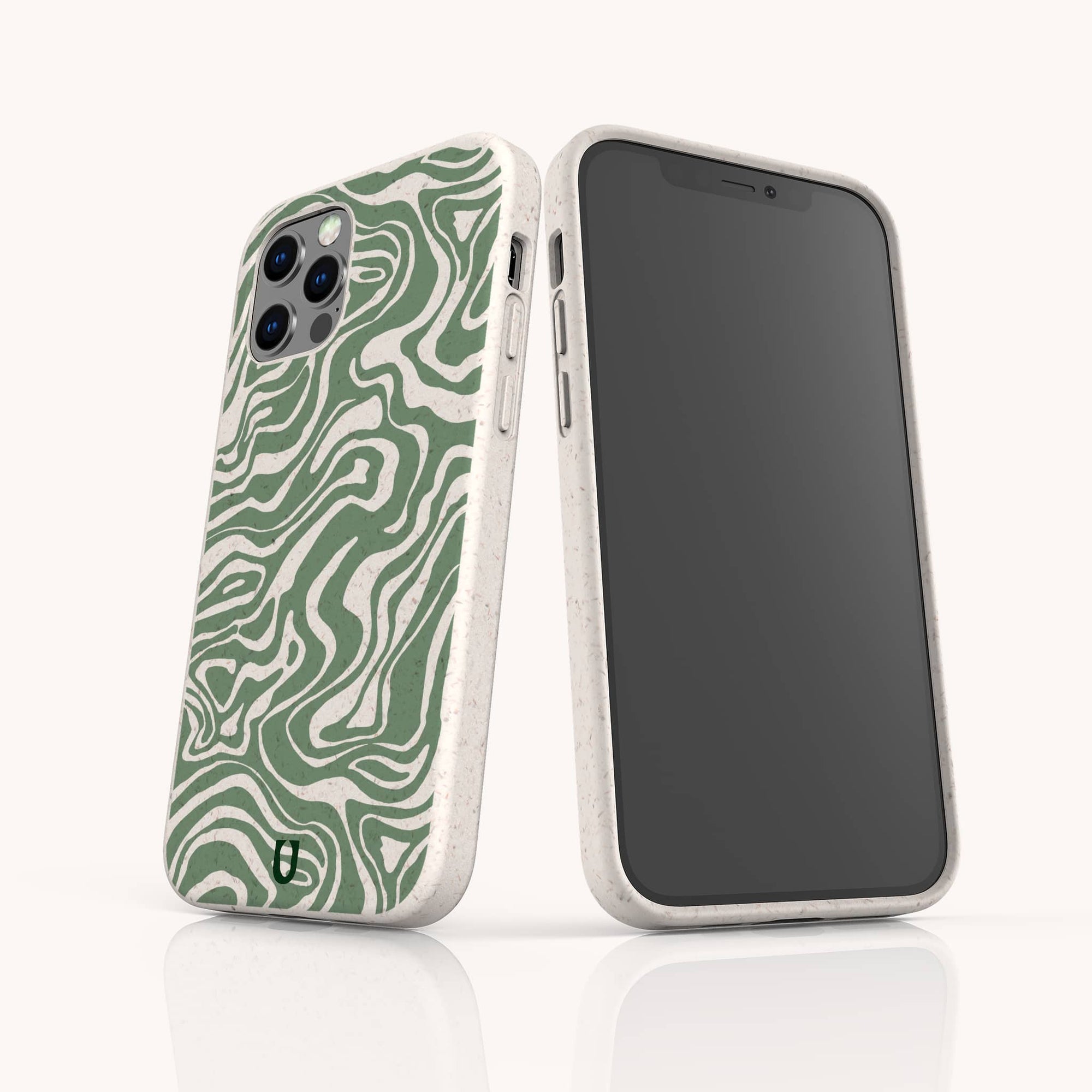 Two smartphones in white eco-friendly cases stand on a white surface. One features the Green Marble Swirl Eco-Friendly Phone Case with a green and white wavy pattern; the other shows its plain black screen against a light background.