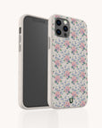 The Pink Coquette Flowers Eco-Friendly Biodegradable Phone Case is shown in both front and back views against a plain white background. This white case features a charming pink and blue coquette floral pattern, reminiscent of a vintage floral design.