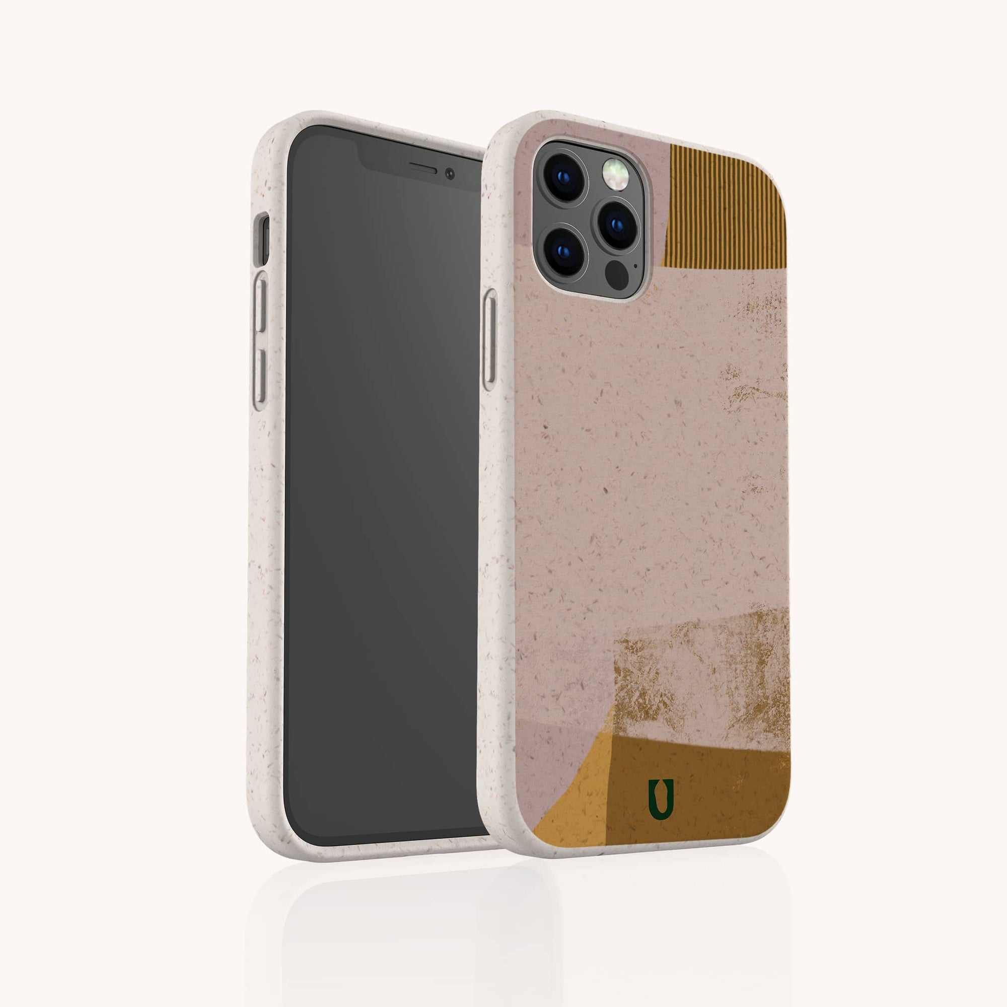 A smartphone with a rear camera is shown in the Caramel Abstract Strokes Eco-Friendly Phone Case, which features beige, pink, gold, and brown designs plus a small green "U" logo for sustainable protection.