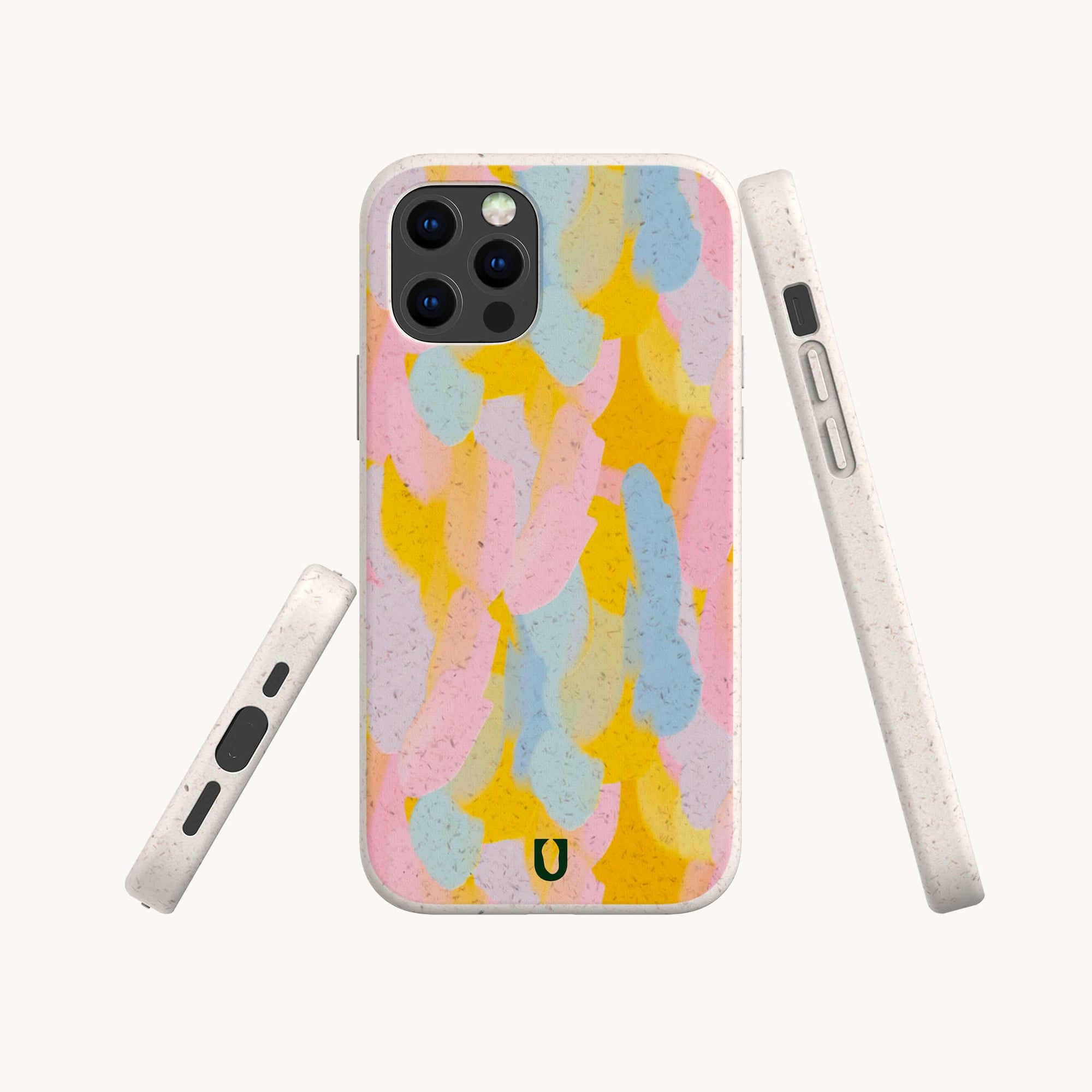 The Bubble Gum Eco-Friendly Phone Case features a pastel abstract pattern with vibrant pink, yellow, blue, and beige brushstrokes, displayed from the back, side, and front on a plain white background.