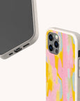 Two smartphones in Mango Sorbet Eco-Friendly Phone Cases, speckled beige and biodegradable; one displays the screen, the other reveals a colorful abstract back. Both cases feature precise cutouts and fit iPhone and Samsung Galaxy models.