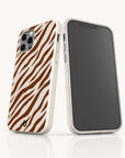 Two smartphones in Brown Zebra Eco-Friendly Phone Cases, featuring a brown and white zebra stripe pattern. One phone displays the back of the case, while the other shows the screen. Both stand upright on a white surface.