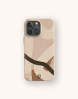 The Beige Abstract Eco-Friendly Phone Case features beige with abstract brown and tan shapes, a small green and black logo at the bottom center, is made from biodegradable materials, and fits iPhone and Samsung Galaxy models.