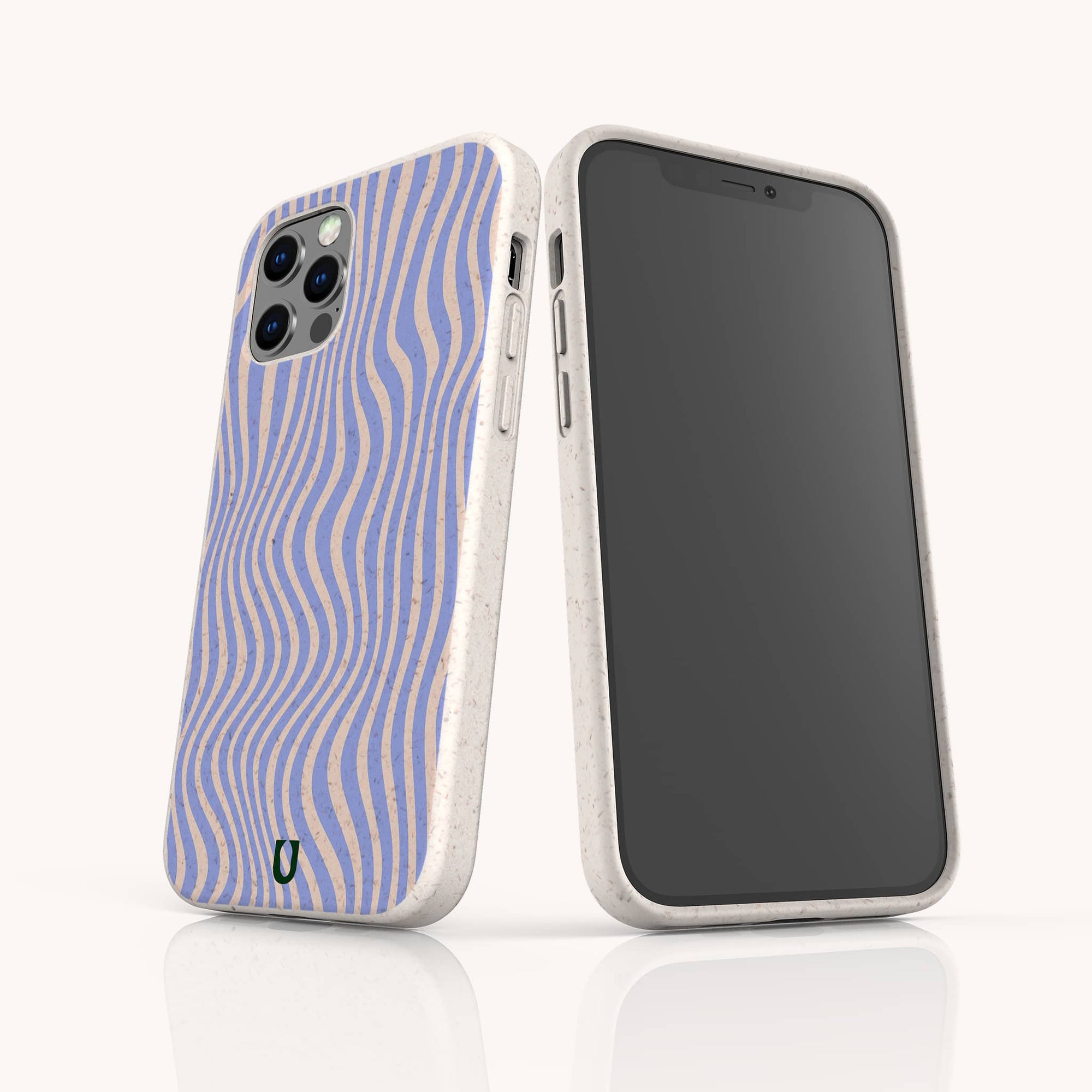Two smartphones in white speckled, eco-friendly cases—including the Blue Distort Lines Eco-Friendly Phone Case—stand upright. One shows a wavy blue and beige pattern; the other reveals its black screen on a light background.