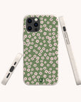 The Vintage Green Flowers Eco-Friendly Phone Case features a green background with white and pink flowers. Displayed from the back, side, and bottom on a plain light background.