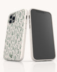 Two smartphones in speckled off-white cases are displayed against a plain white background; one showcases the Green Wild Flowers Eco-Friendly Phone Case, featuring a botanical green plant pattern that embodies a minimalist floral design, while the other has its screen turned off. These phone cases are crafted with sustainability in mind.