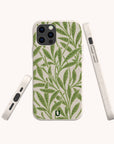 The Willow Eco-Friendly Phone Case features a green leafy plant pattern on beige, made from plant-based materials. Displayed in back, side, and angled views on an off-white surface. Fits iPhone and Samsung Galaxy models.