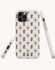 The Sunny Side Up Eco-Friendly Phone Case is shown from the back and sides, highlighting its beige color, sustainable design, and perfect fit. The case features a pattern of green cacti and purple flowers for an eco-conscious yet stylish look.