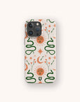 Introducing The Sun and the Moon Eco-Friendly Phone Case—a compostable phone case adorned with a celestial pattern of orange suns with faces, green snakes, stars, arrows, and crescent moons set against a light beige background. This sustainable case brings together eye-catching design and environmental responsibility.