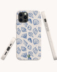 Three white Sea Shells Eco-Friendly Phone Cases display a blue seashell and leaf pattern, with one showing the back and two highlighting side views, including button and port openings. Compatible with iPhone and Samsung Galaxy.