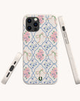 The Pink Ribbons Eco-Friendly Biodegradable Phone Case features a pastel floral pattern with pink flowers and green bows on a white background, shown from various angles on a plain, light backdrop.