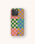 Introducing the Colour Checker Eco-Friendly Phone Case, featuring a vibrant checkered pattern in green, yellow, pink, purple, and blue squares with a small black logo at the bottom center. Designed for both iPhone and Samsung Galaxy models, this eye-catching accessory not only enhances your device’s style and personality but is also an eco-friendly choice.