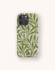 The Willow Eco-Friendly Phone Case features a green leafy botanical pattern on a beige background and fits iPhone and Samsung Galaxy models, shown against a plain light backdrop.