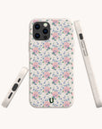 The Pink Coquette Flowers Eco-Friendly Biodegradable Phone Case, featuring a pastel pink and purple floral design, is shown from the back, side, and bottom on a white background, providing stylish sustainable protection for your device.
