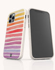 Two smartphones with white cases are displayed upright on a reflective surface against a plain background. One case, the Summer Rainbow Eco-Friendly Phone Case, features horizontal rainbow-colored stripes, while the other shows the phone’s screen.