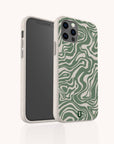 A smartphone is shown from the front and back in a beige Green Marble Swirl Eco-Friendly Phone Case featuring green and white wavy abstract patterns.