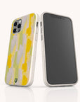 Two smartphones in Lime Sorbet Eco-Friendly Phone Cases stand upright on a white surface; one shows the screen, the other displays the back with an abstract yellow and lavender brushstroke design.