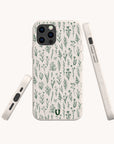 The Green Wild Flowers Eco-Friendly Phone Case features a minimalist botanical design on biodegradable materials. Displayed from the back and sides on a white background, it fits iPhone and Samsung Galaxy models.