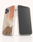 Two smartphones in Pink and Brown Watercolour Eco-Friendly Phone Cases. One phone displays the screen, while the other showcases the sustainable, compostable design with abstract earthy patterns in pink, beige, and brown tones.
