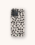 A Little Black Flowers Eco-Friendly Biodegradable Phone Case in beige, featuring a pattern of small black flowers, shown from the back.