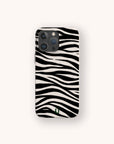 The Zebra Eco-Friendly Phone Case, featuring black and white zebra stripes inspired by animal designs, is displayed on a light background. A small green logo at the bottom highlights its compostable, biodegradable materials.
