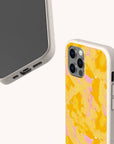 Two smartphones in beige speckled Papaya Eco-Friendly Biodegradable Phone Cases; one displays the screen, while the other shows off the back with a yellow and pink abstract pattern. Both cases have cutouts for ports, buttons, and cameras.