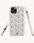Three views of the Pink Coquette Flowers Eco-Friendly Biodegradable Phone Case, featuring a delicate floral pattern with pink flowers and green leaves on a white background, displayed against a plain, light backdrop. This vintage-inspired case combines timeless charm with modern eco-friendly style.
