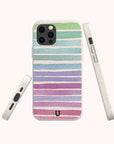 The Winter Rainbow Eco-Friendly Phone Case, shown from the back and sides on a plain background, features biodegradable materials and pastel green, blue, purple, and pink horizontal stripes—ideal for sustainable style lovers.