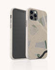 The Green Abstract Lines Eco-Friendly Phone Case, featuring green and black abstract designs, is displayed upright on a smartphone with both the screen and back visible against a plain white background.