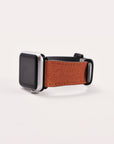 Introducing the Abstract Cut Out II Vegan Leather Apple Watch Band, a stunning smartwatch accessory showcasing a rectangular face and sleek metallic frame. Its trendy design and cruelty-free faux leather strap are elegantly displayed against a plain white background, emphasizing its minimalist and classic appeal while embracing sustainable style.