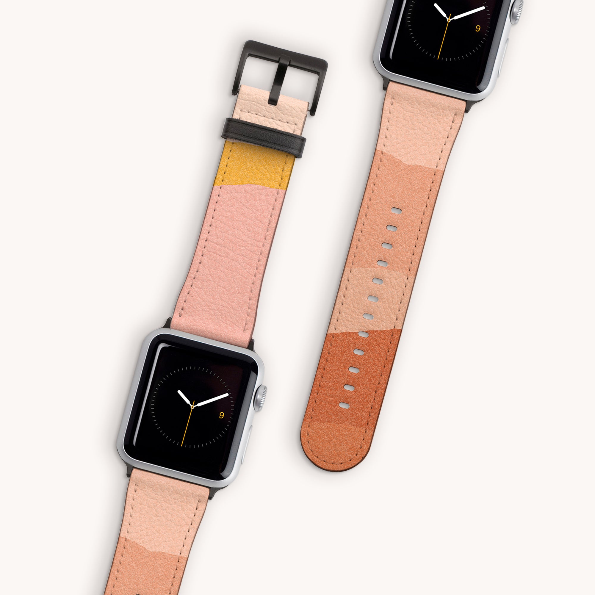 Two smartwatches with square faces showcase the Abstract Cut Out III Vegan Leather Apple Watch Bands. The bands feature abstract color blocks in shades of pink, yellow, and brown. One watch displays a clock face while the other highlights the unfastened strap. These cruelty-free straps are stylish and water-resistant.