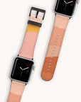 Two smartwatches with square faces showcase the Abstract Cut Out III Vegan Leather Apple Watch Bands. The bands feature abstract color blocks in shades of pink, yellow, and brown. One watch displays a clock face while the other highlights the unfastened strap. These cruelty-free straps are stylish and water-resistant.