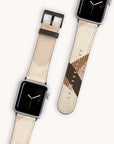 Two smartwatches with Beige Abstract Lines Vegan Leather Apple Watch Bands are elegantly presented. One band showcases a geometric design in shades of brown and olive green. The watch faces display analog time with orange accents on a soft beige background enhanced with abstract lines, highlighting the use of cruelty-free materials.
